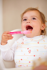 Image showing Baby girl, spoon and eating for nutrition, food and development with happiness at home, house and living room. Female child, infant and kid excited for feeding, breakfast and snack for growth