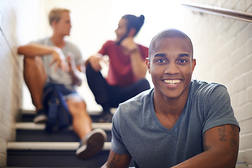 Image showing Black student, friends and happy with portrait on staircase for conversation at recess, break and campus. People, talking and relax on steps in hallway at university between lecture or study class