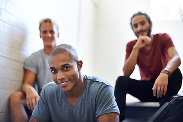 Image showing Black student, classmates and happy with portrait on staircase for conversation at recess, break and campus. Diverse people, talking and relax on steps in hallway at college between lecture or class.