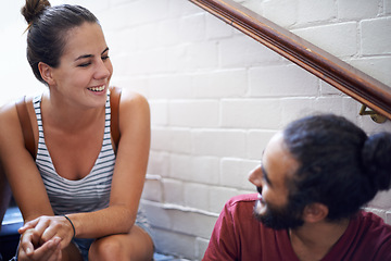 Image showing Campus, woman and man together on stairs with smile, backpack and classmates as friends. University, school and people in course for education with scholarship, laughing and conversation to relax