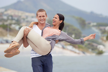 Image showing Smile, portrait and man carrying woman in street with freedom, happiness and date on vacation in Mexico. Sea, couple and happy with love in city for romance, travel and adventure on holiday together