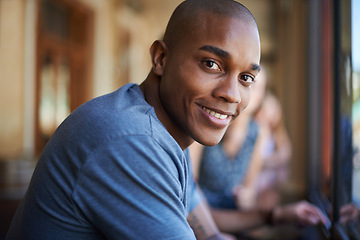 Image showing Portrait, smile and a black man at cafe to relax, cheerful and positive face for leisure at restaurant in Kenya. Facial, cafeteria and happy African person or young customer in casual clothes at shop