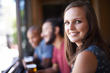 Image showing Portrait, happy and a woman at pub to relax, cheerful or positive facial expression for leisure at restaurant tavern. Face, bar and smile of young female person or casual customer at cafe for alcohol