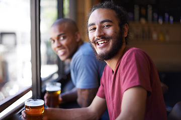 Image showing Friends, beer and chill in portrait, smile and relax indoor for fun and bonding in summer to destress. Male people, pub and man for social, guys and alcohol drink together and laughing on weekend.