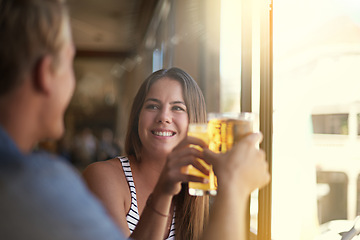 Image showing Toast, happy couple and drink beer in pub at party for celebration, relax and leisure together in restaurant. Smile, man and woman cheers with alcohol, beverage or glass at bar on a date at club