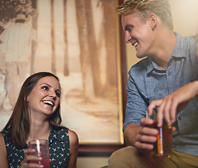 Image showing Love, smile and couple drinking in pub together for bonding, conversation and dating on weekend. Beer, happy or party with young man and woman at bar to drink alcohol from glass for celebration