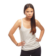 Image showing Serious, confidence and portrait of woman in studio, white background and mock up space. Casual, fashion and person with cool outfit or trendy style for university or college with moody attitude