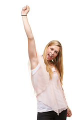 Image showing Woman, goals and fist for portrait in studio with success, winner or happy by white background. Person, girl and smile for celebration, cheers or excited for achievement, giveaway or prize in contest