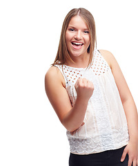 Image showing Woman, winner and fist for portrait in studio with success, goal or happy by white background. Person, girl and smile with celebration, cheers or excited for achievement, giveaway or prize in contest