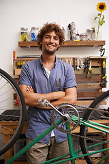 Image showing Mechanic, bicycle and smile with tools at workshop for repair, maintenance with small business. Entrepreneur, handyman and garage as expert for diy to fix bike with equipment for service and upgrade