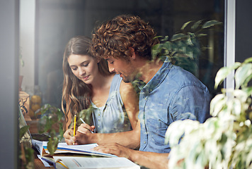 Image showing Man, woman and research for writing, education and tutor in cafe in urban indoor bistro. Couple, journalist and copywriter for window, college and reading for knowledge and love for date together