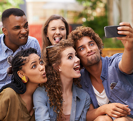 Image showing Friends, happy and crazy selfie on campus for comedy, care and profile picture to update on social media. Students, diversity or mobile app for photography at university or memory together in outdoor