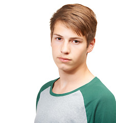 Image showing Boy, portrait and serious in studio with casual outfit for school, teenager and innocent student. Person, isolated and white background with relaxed fashion for youth or preteen and middle adolescent