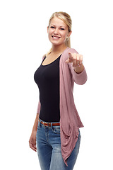 Image showing Fashion, woman and choice with smile in studio on white background, casual clothes and trendy outfit. Female person, pointing finger and happy with style for confidence, elegant and stylish jeans.