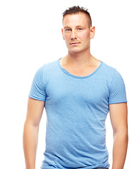 Image showing Portrait, man and confidence for fashion, clothing and trendy style in contemporary looks on studio background with happiness, casual outfit and smile. Male person, model and face in blue t shirt