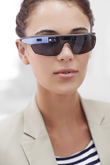 Image showing Virtual reality, portrait and woman with smart glasses for technology, internet or protection from sun. Metaverse, bokeh and face of female person for sunglasses, innovation and user experience.