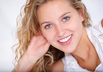 Image showing Woman, smile and portrait for laying on bed to relax, bedroom and closeup with happiness and blue eyes. Female person, wavy hair and proud for calm, peace and confident inside home to look cute