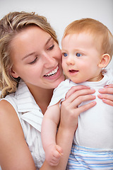 Image showing Happy mother, baby and hug with love for embrace in care, trust or bonding together on holiday at home. Face of mom and little toddler with smile for family, childhood or motherhood in relax at house
