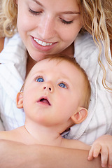 Image showing Baby, bonding and happy with mother, relaxing and love together with child and care for motherhood. Infant, mom and smile for affection, nurture and home for growth and babysitting with family