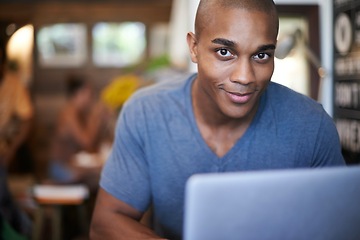 Image showing African man, portrait and laptop in cafe, restaurant and coffee shop working for creative career. Male person, gen z guy and freelancer with happiness for job in research, internet and web design