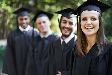 Image showing Graduation, classmates and woman for portrait, ceremony and students for education and college for campus. Outdoor, degree and celebration for university, friends and together with cap and gown