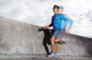 Image showing Motion blur, workout and athlete running on road for energy, exercise and practice for marathon in city. Mock up, male person and runner in street for cardio of speed for sports and wellness