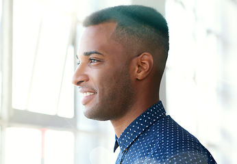 Image showing Businessman, thinking and smiling through window with vision for future dream, startup and company. Black male person, ideas and standing at building opening with thoughts for growth, career and work