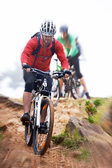 Image showing Man, bicycle and cycling on dirt road for fitness, extreme sports or cardio exercise in nature. Male person, athlete or cyclist riding bike on rocky path, trail or outdoor slope with motion blur