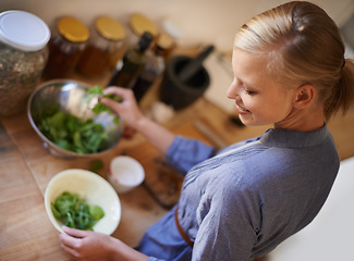 Image showing Cooking, woman and salad in a home with diet, nutrition and healthy food with smile from above. Kitchen, bowl and leaves for organic and vegan lunch with bowl and wood board in a house with wellness