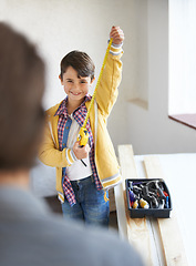 Image showing Father, son and building for house, construction and teaching moment for child with tools. Dad, kid and smile for renovation, project and home repairs while bonding, woodwork and measuring tape