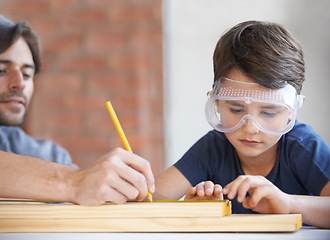 Image showing Father, kid and woodwork at home for project, bonding and building with safety gear. Dad, son and carpenter for renovating, measuring and teaching with help for development of house with goggles