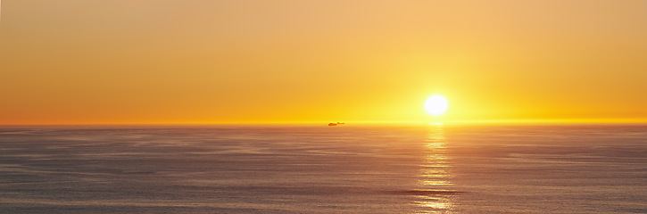 Image showing Ocean, sunset and sun on horizon on tropical island and tourism destination for summer vacation in nature. Blue sky, clouds and golden sky on torrey pines beach, landscape and sunshine for salutation