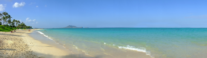 Image showing Sand, ocean and landscape of beach in Hawaii for tropical holiday, vacation and travel destination. Nature, island and seashore, waves and water in summer weekend for location, background and horizon