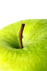 Image showing Closeup, green apple and stem with natural vitamins for diet, nutrition or snack on a white studio background. Organic fruit, food or vegan meal of consumables for health and wellness on mockup space