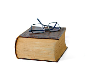 Image showing Old, book and glasses with ancient manuscript for knowledge, literature or history on a white studio background. Closeup of historic novel or spectacles for vintage scripture or reading on mockup