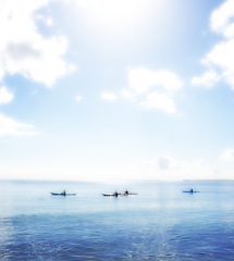 Image showing Water, ocean and group rowing kayak on holiday, vacation or travel in summer outdoor. Sea, people and canoeing together in transportation for exercise, sport and silhouette in nature on mockup space