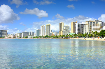 Image showing Beach, city and building development on coast for holiday destination in Miami for vacation, swimming or explore. Sea, skyscraper and urban downtown travel for summer getaway, architecture or water