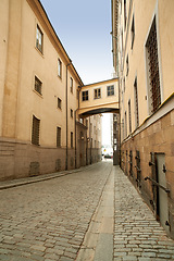 Image showing Village, road and buildings with vintage for architecture, heritage and culture for tourism in Italy. Ancient, traditional and street for travel in historic community or neighborhood for tourist.