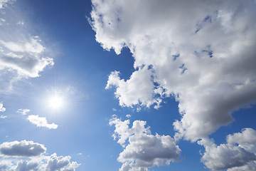 Image showing Sun, cloud and blue sky with heaven or nature for hope, faith or natural outdoor scenery. Sunny day, cloudy fog and sphere of sunshine, celestial ball or bright orb in the air for summer or weather