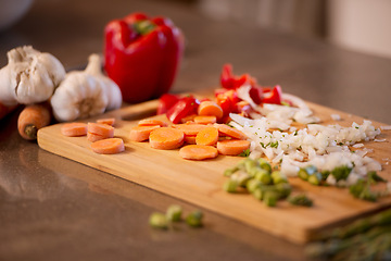 Image showing Chopped veggies, cutting board and meal prep for chef, restaurant and bistro for healthy eating. Food, kitchen and nutrition for lunch, dinner and home cooking cuisine for diet or vegan appetite