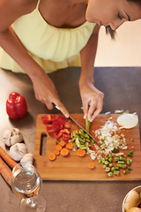 Image showing Chef, food and health with woman in kitchen of home to prepare meal for diet or nutrition from above. Cooking, nutritionist or vegan and person cutting green vegetables with knife in apartment