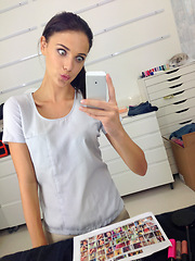 Image showing Woman, selfie and phone for fashion, makeup and cosmetics in dressing room. Photo, media and makeup artist for picture, eyeliner and blush for mascara in mirror with pout face and quirky confidence