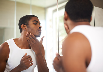 Image showing Bathroom, mirror and black man grooming for skincare, self care and treatment for face of adult. African male person, morning and health with dermatology for results of soft, shave and glow of skin