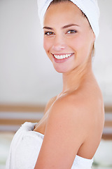 Image showing Portrait, spa and skincare of happy woman in bathroom for wellness or beauty at home. Face, towel and natural cosmetics of female person with facial treatment, cleaning or hygiene for healthy body