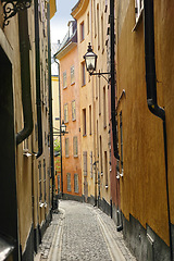 Image showing Travel, architecture and buildings on vintage alley with history, culture or holiday destination in Sweden. Vacation, old road and antique stone street in Stockholm with cobble path in ancient city