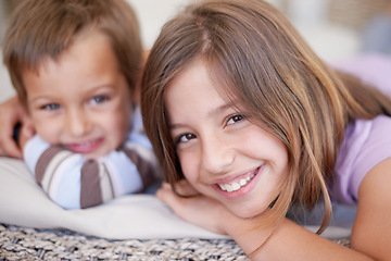 Image showing Portrait, kids and smile for family, brother and sister at home in living room on rug together. Children, happy and bonding in the house, relaxing and lounge or bedroom for sibling fun and joy