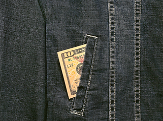 Image showing Ten american dollars in a pocket of a denim jacket