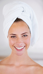 Image showing Portrait, beauty and skincare of happy woman in spa for wellness in bathroom at home. Face, towel and natural cosmetics of female person with facial treatment, dermatology and glow for healthy skin