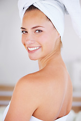 Image showing Portrait, beauty and skincare of happy woman in bathroom for wellness at home. Face, towel and natural cosmetics of young female person with spa facial treatment, dermatology or glow for healthy body