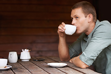 Image showing Thinking, idea and man at a cafe for coffee break, chilling or morning caffeine routine. Restaurant, tea cup and male person with moment of reflection, memory or calm contemplation while drinking